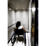 Passenger in wheelchair inside the LU/LA elevator