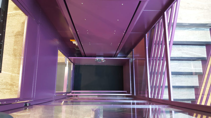 Symmetry Custom Vertical Platform Lift purple hoistway view from top