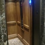 Symmetry LU/LA Elevator Custom Wood Interior Installed by DME