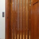 Home elevator wrap around gate with vision panels