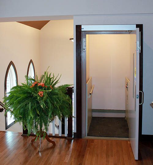 Church lift next to large fern