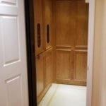 Symmetry Home Elevator Red Oak Clear Coat with Vintage Bronze hardware