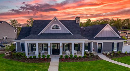 beautiful sunset new construction home with elevator