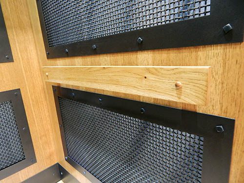 wooden handrail in custom mineshaft cab