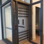 Symmetry Home Elevator Glass and Steel Hoistway Enterprise Gate