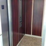 Symmetry LU/LA Elevator with applied panels carpeted floor