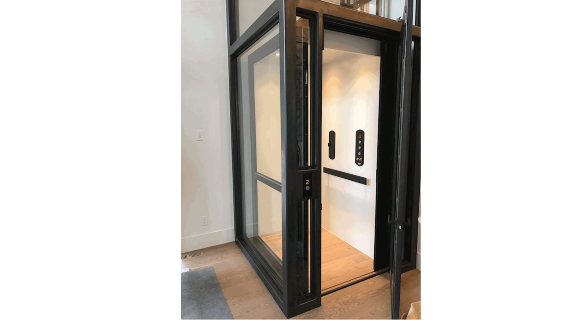 Black Stainless Steel cab with glass and wood floor