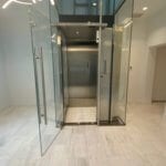 Symmetry Home Elevator Stainless Steel Car in Glass Hoistway