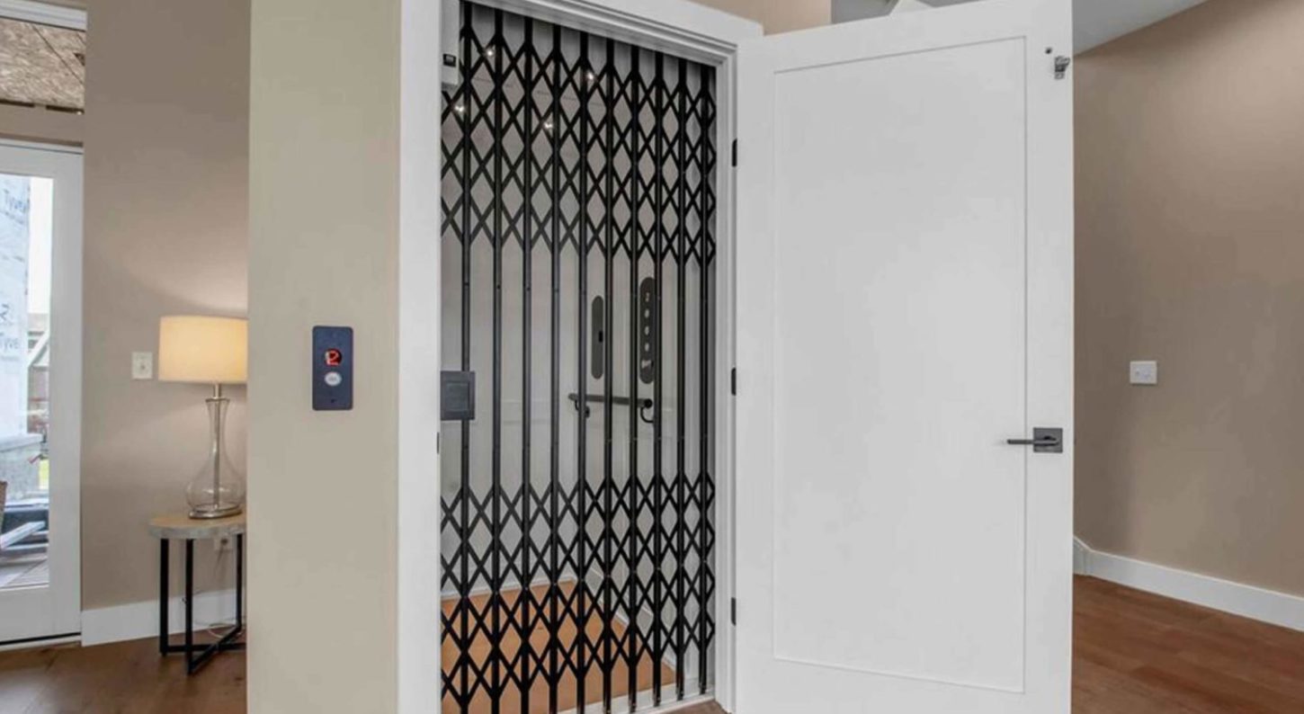 Symmetry Home Elevator in White with Black collapsible gate-blog