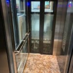 Symmetry LULA Elevator with custom Glass Door inside view