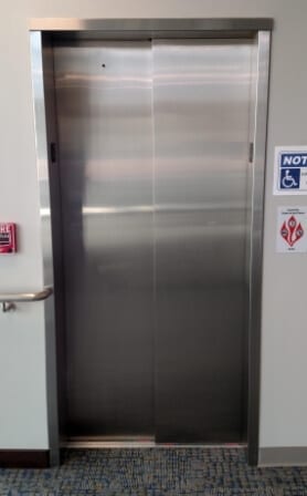 Symmetry LULA Elevator Two Speed Doors in optional Brushed Stainless Steel