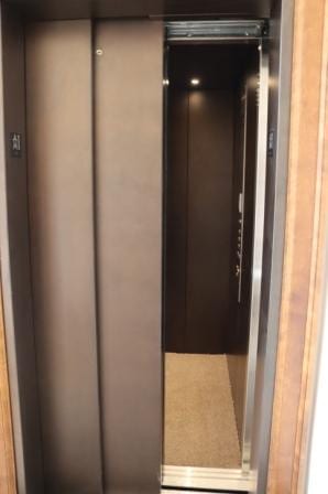 Symmetry LULA Elevator Two Speed Doors in optional Vintage Bronze