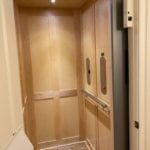 Symmetry Home Elevator with Birch Shaker Car Panels door with plastic baffle