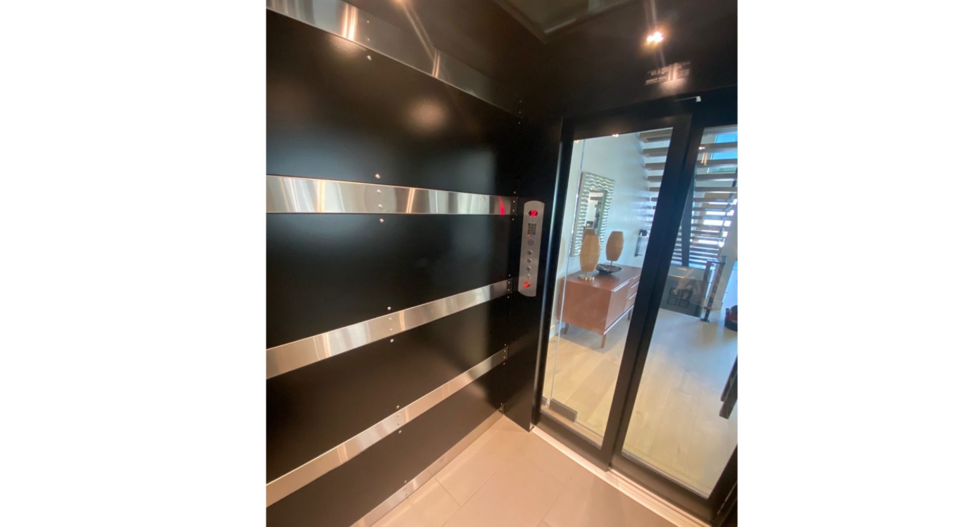 Custom Black and Stainless Steel Symmetry Home Elevator